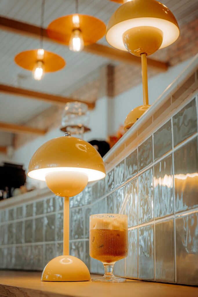 cozy-cafe-lamp-with-iced-coffee-on-counter-32166427